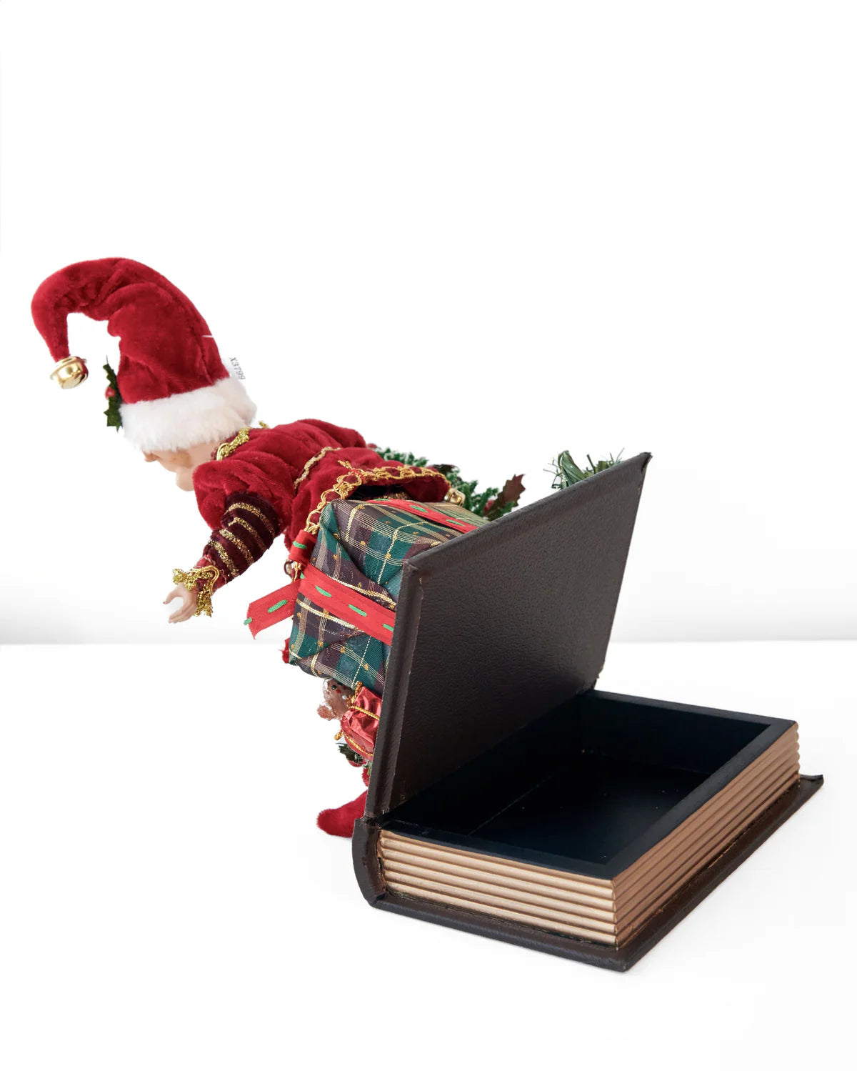 CHRISTMAS ELF ON OPENING BOOK