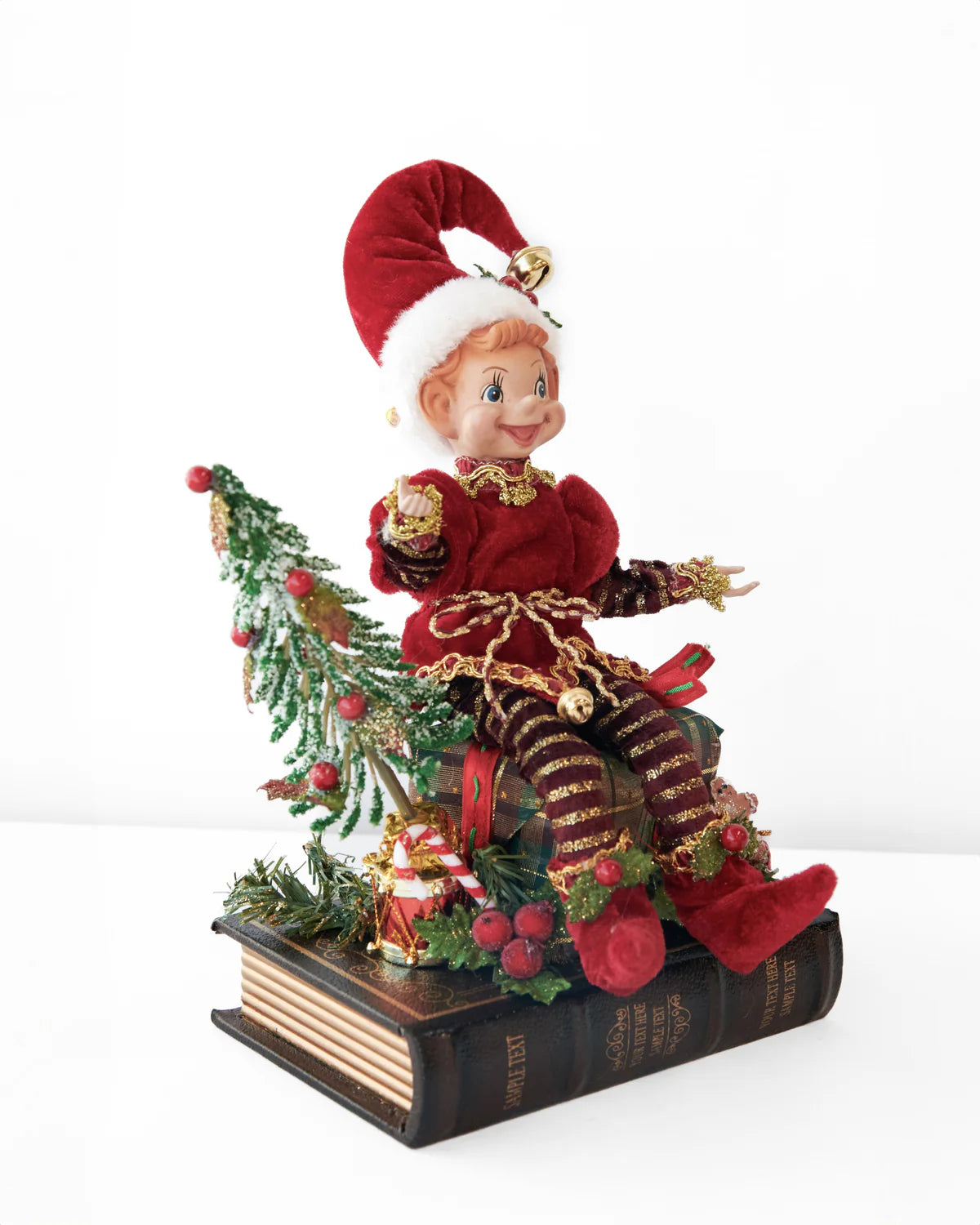 CHRISTMAS ELF ON OPENING BOOK