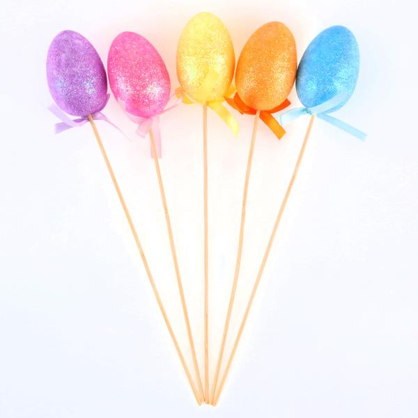 Polystyrene Egg On Pick With Glitter 5pc Total Length: 26cm (Egg - 6cm x 4cm) Blue, Yellow, Pink, Purple & Orange Per Pack